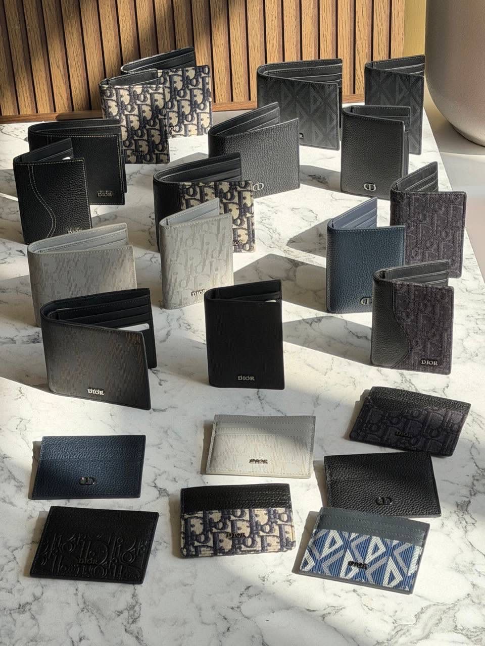 Dior wallets, including the Saddle Wallet with Coin Pocket